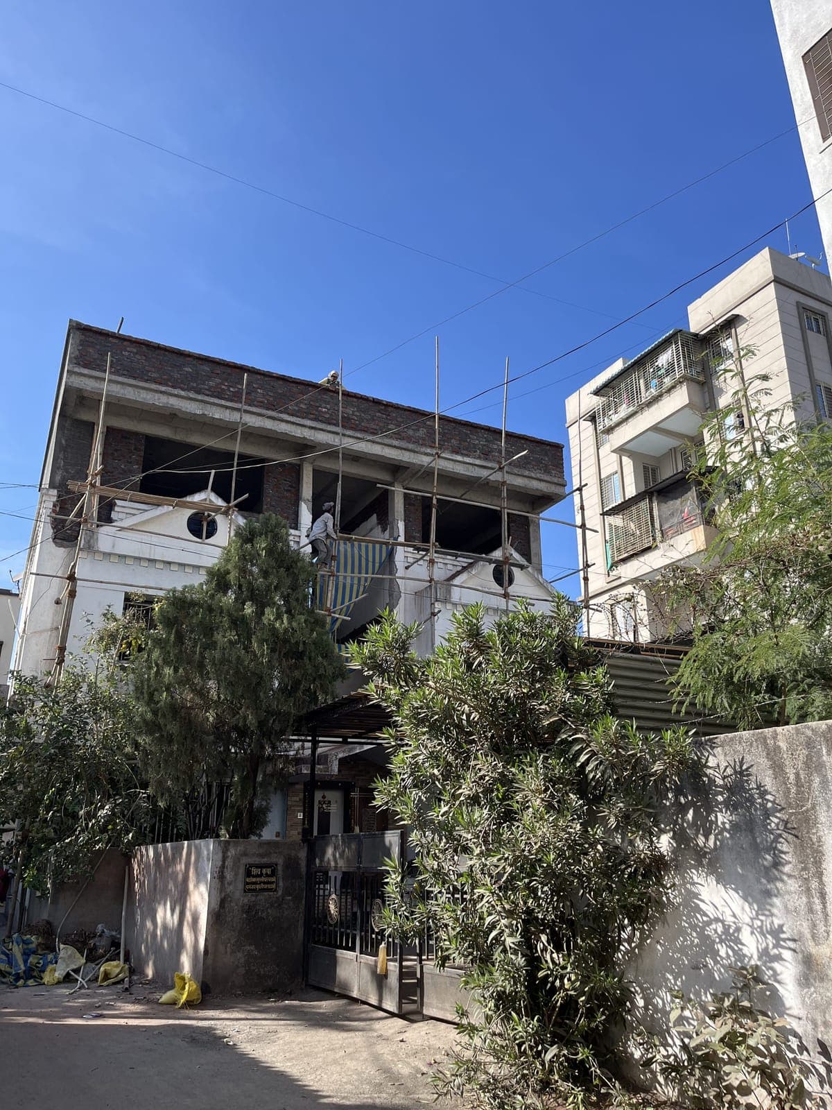 Front elevation under scaffolding — Padale House, Kalewadi, Pune