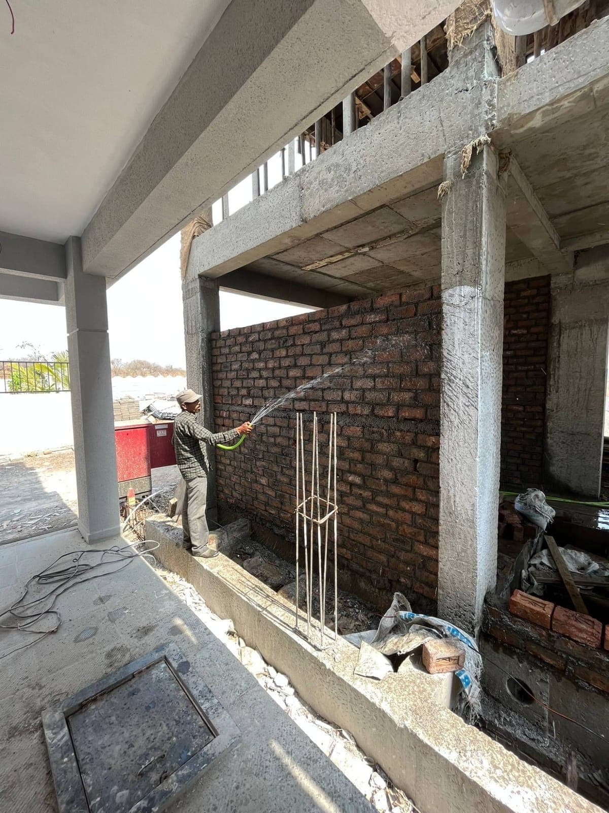Brickwork curing — Shinde House, Charholi, Pune