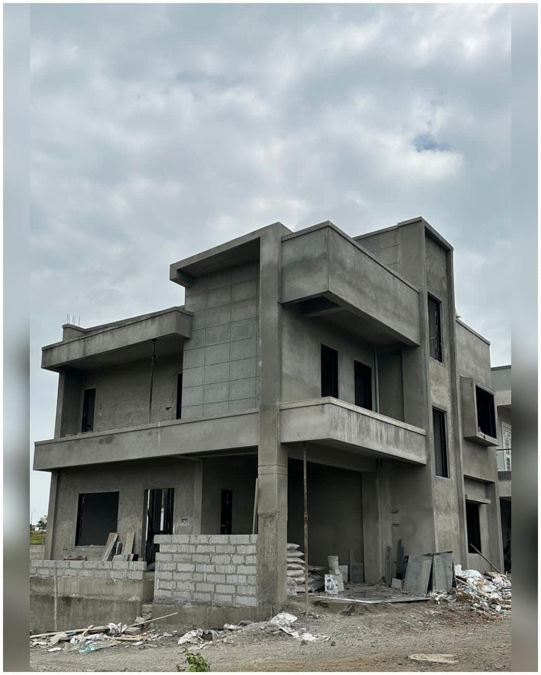 Plastered shell — corner view — Shinde House, Charholi, Pune