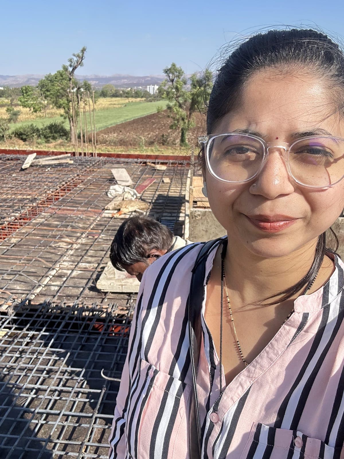 Ar. Karishma Thange checking slab reinforcement on site, Shirwal Residence, Satara