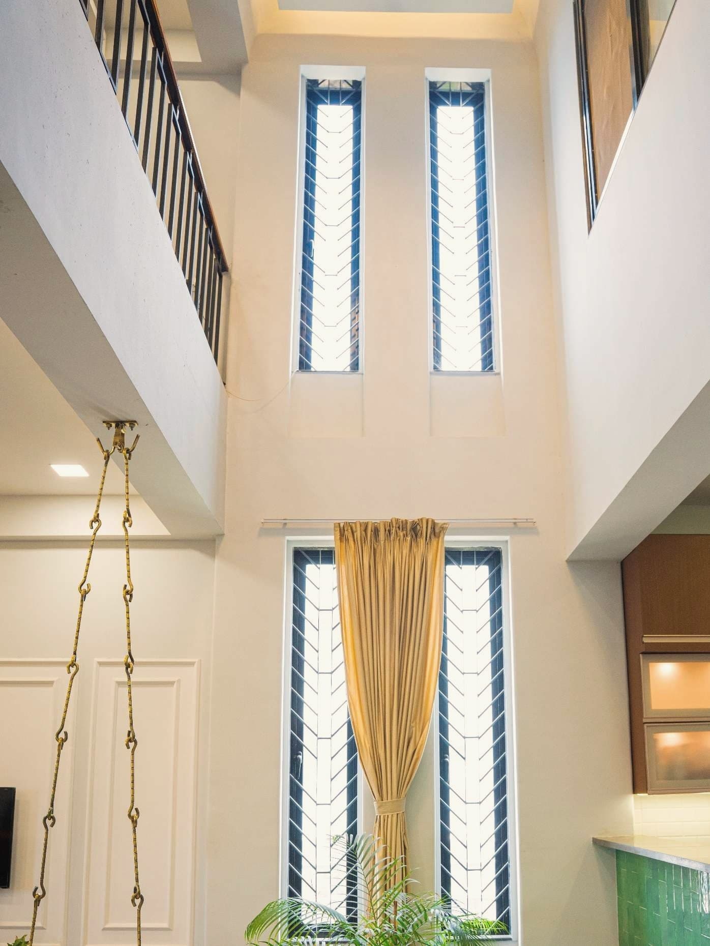 Double-height central atrium with jali windows, Shinde House, Charholi, Pune