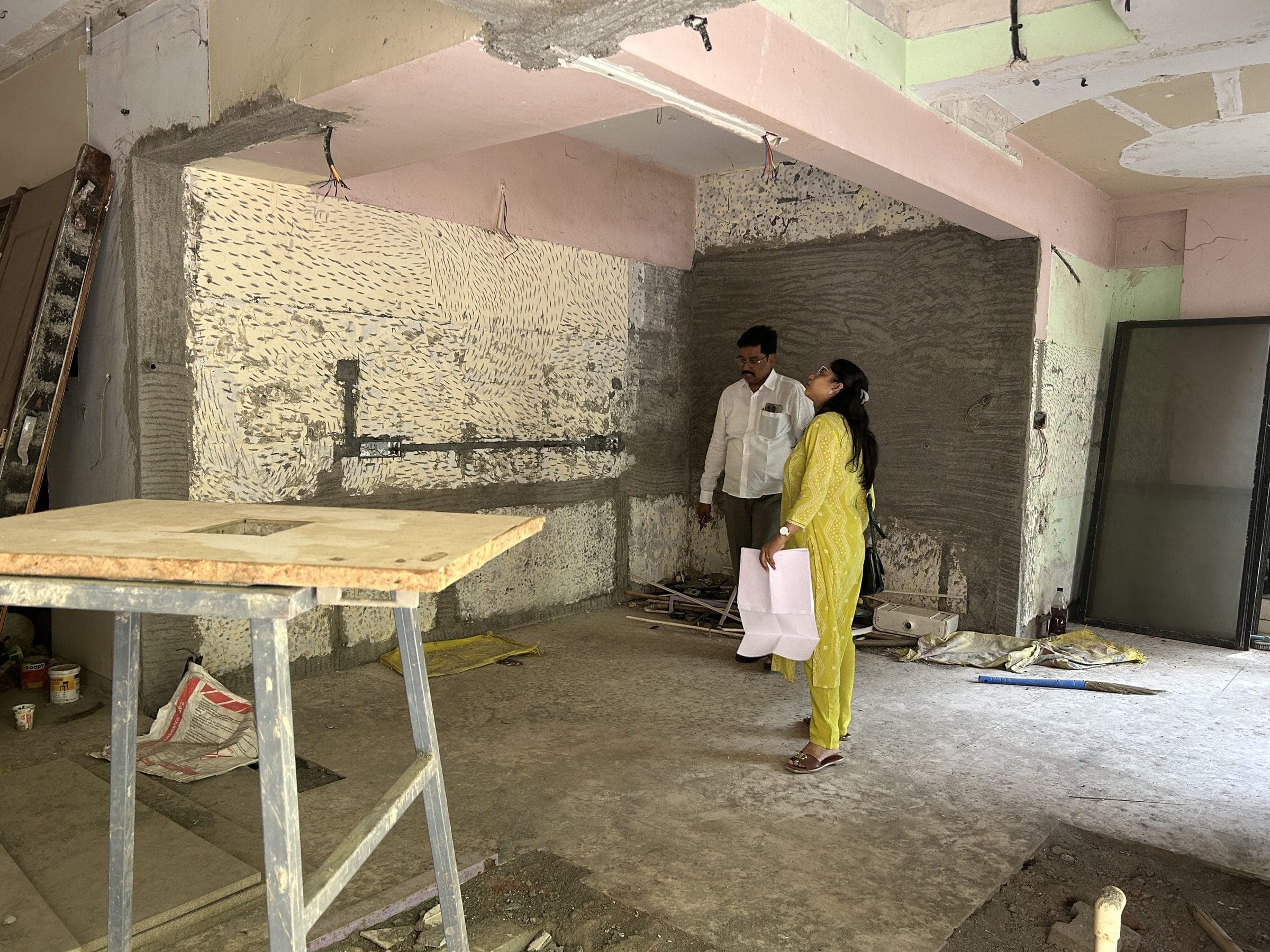 Ar. Karishma Thange discussing drawings with the site team, Shriram Nagari Patsanstha, Baner, Pune