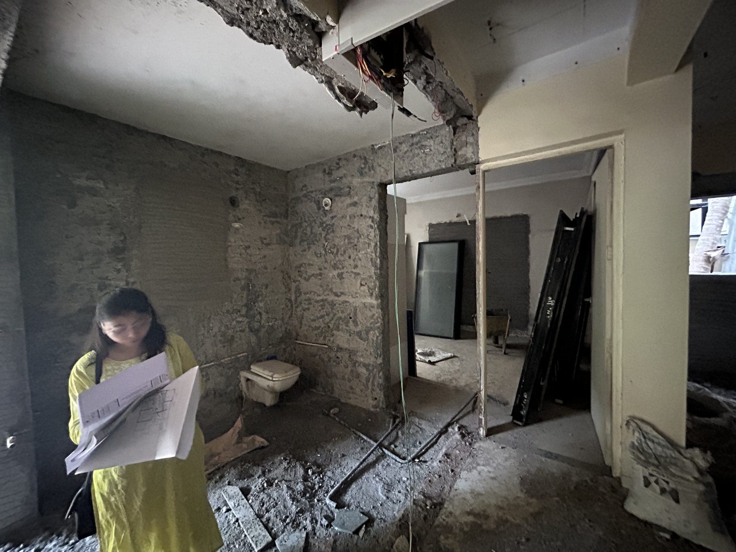 Ar. Karishma Thange reviewing layout drawings on site, Baner, Pune