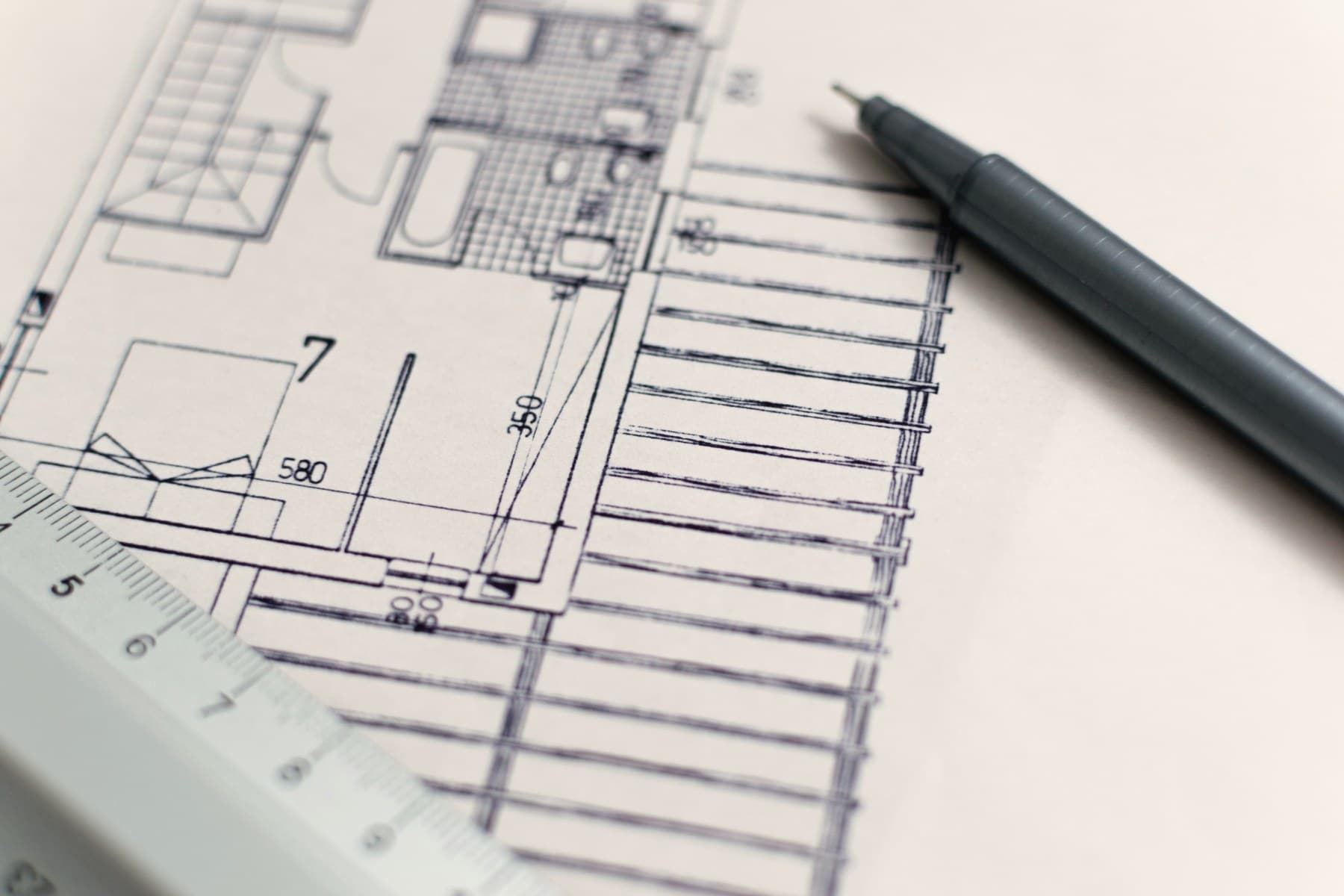 Architectural floor plans being drawn by hand
